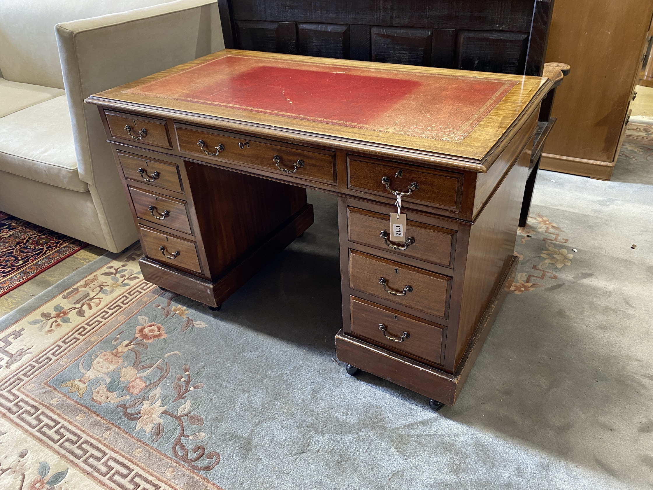 An early 20th century mahogany pedestal desk, width 122cm, depth 65cm, height 76cm